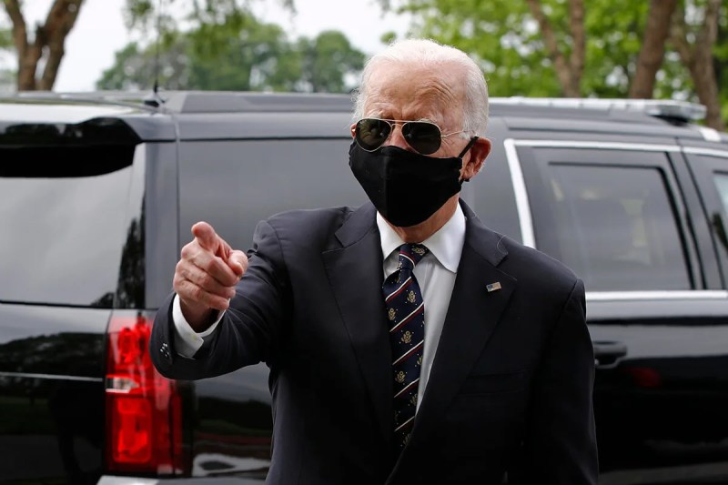 Joe Biden wearing sunglasses and black face mask