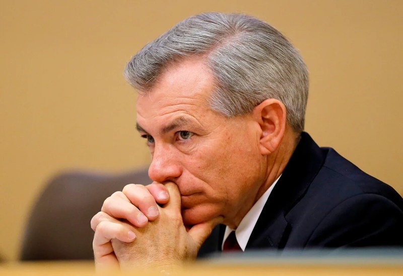 Rep. Schweikert sitting and leaning his chin on his hands