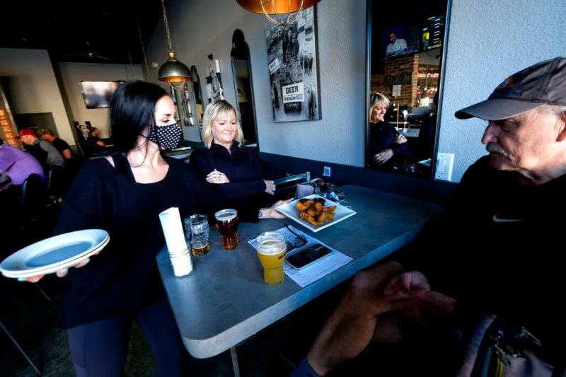 restaurant worker serving tables