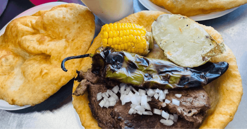 table with fry bread and Native tacos