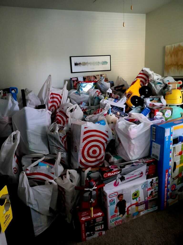 room full of Target bags full of toys