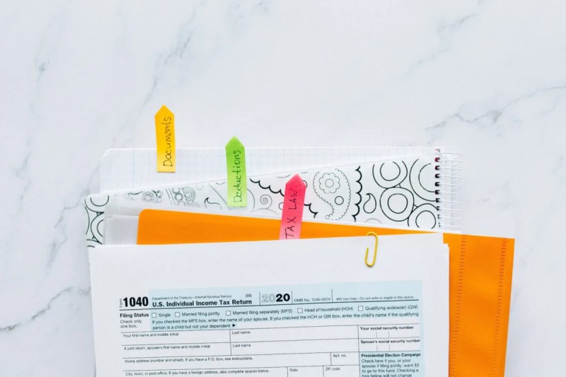 1040 tax form on top of folders