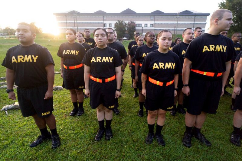FILE - Students in the new Army prep course stand at attention after physical training exercises at Fort Jackson in Columbia, S.C., Aug. 27, 2022. The Army fell about 15,000 soldiers — or 25% — short of its recruitment goal this year, officials confirmed Friday, Sept. 30, despite a frantic effort to make up the widely expected gap in a year when all the military services struggled in a tight jobs market to find young people willing and fit to enlist. (AP Photo/Sean Rayford, File)