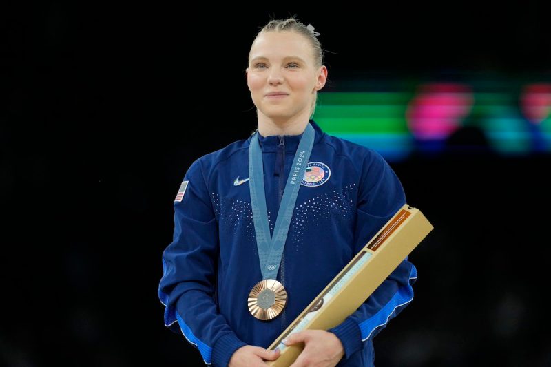 Jade Carey wearing bronze medal