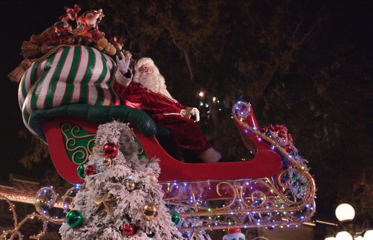 Santa Claus riding a sleigh with presents in an Arizona state park holiday celebration.