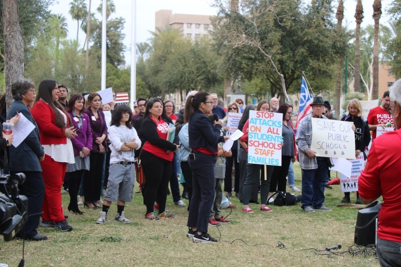 woman speaks to crowd