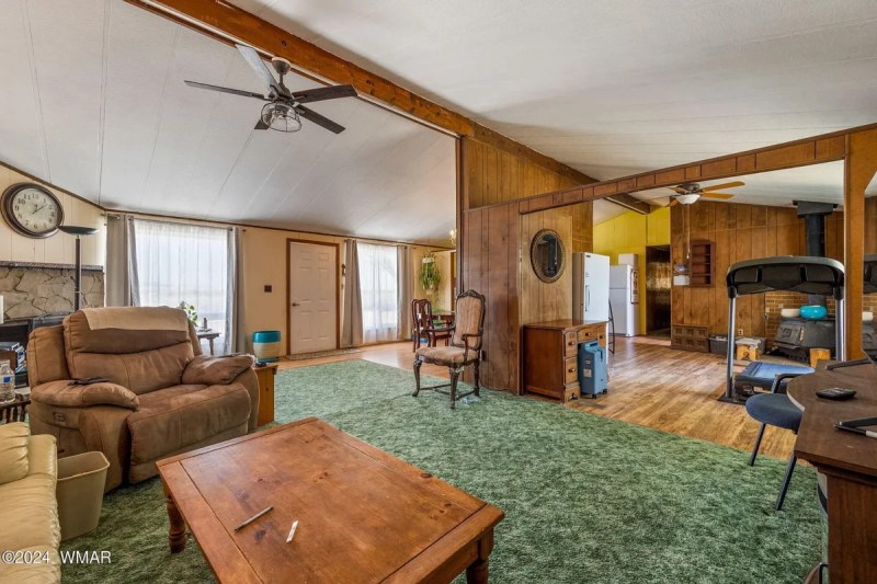 interior of large home showing an open-floor dining room and den