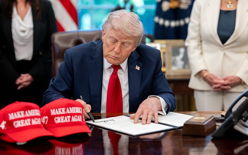 President Donald Trump signs executive orders in the Oval Office