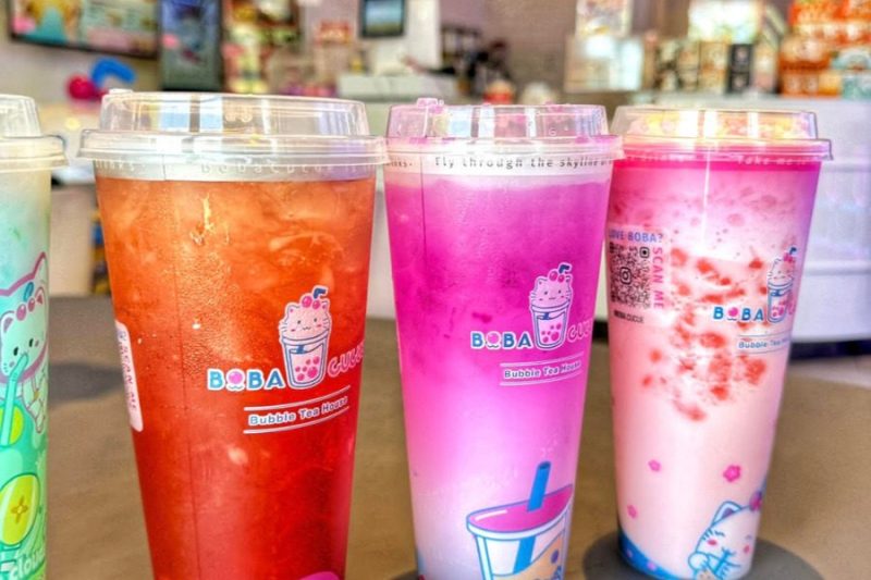 A row of colorful boba bubble tea drinks at Boba Cucue in Tucson
