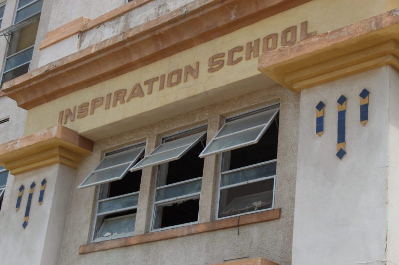 the front exterior of an old schoolhouse