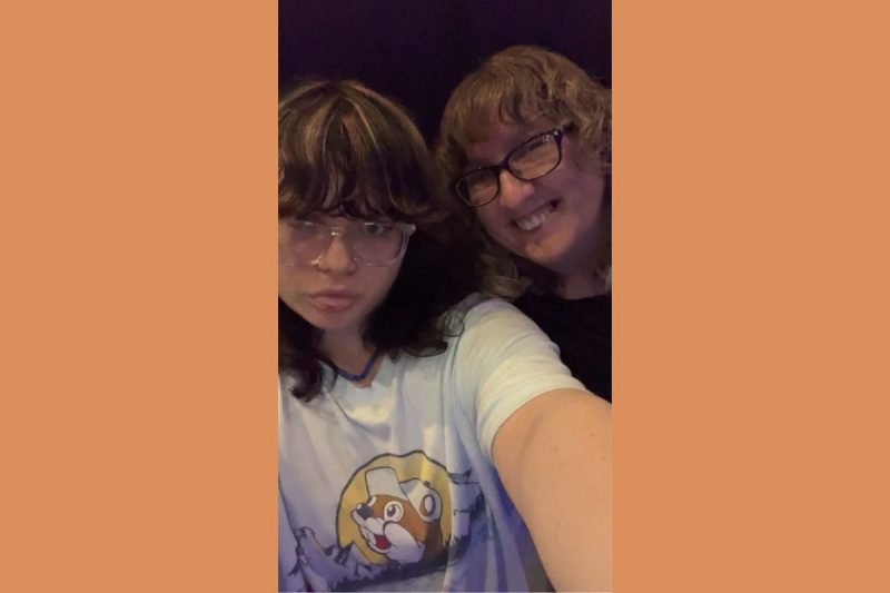 teen posing for selfie with grandmother