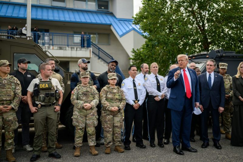Trump standing with military members