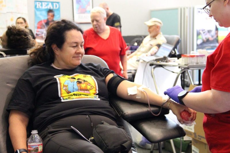 Latina woman giving blood