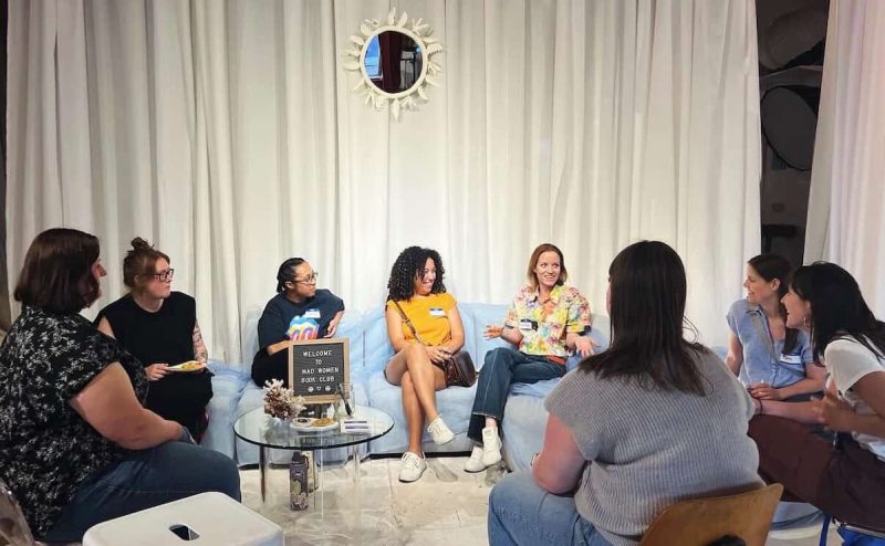 group of women sitting in circle